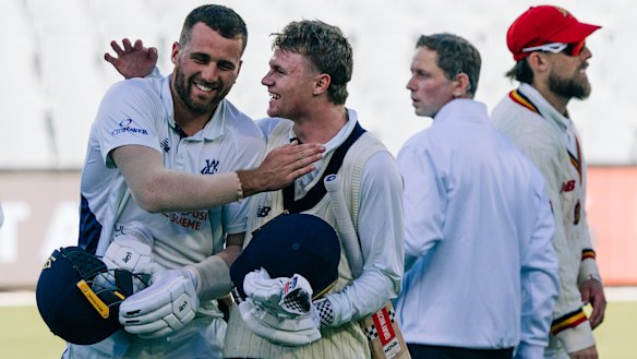 Fergus O’Neill congratulates Ollie Peake on his match-winning Sheffield Shield knock.