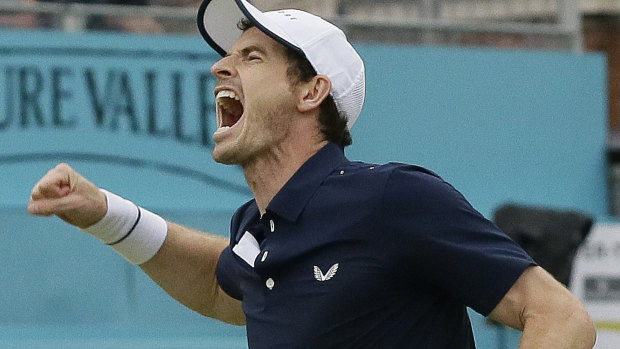 Andy Murray celebrates his Queen's doubles title victory with Feliciano Lopez.