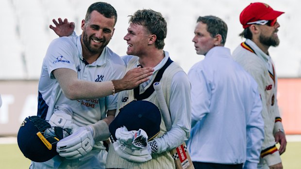 Fergus O’Neill congratulates Ollie Peake on his match-winning Sheffield Shield knock.