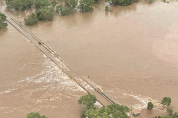 The bridge at Fitzroy Crossing has been flooded following record rains.