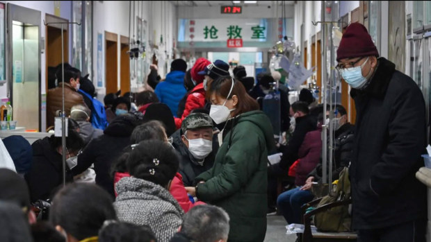 Patients crowding into a Red Cross hospital in Wuhan.
