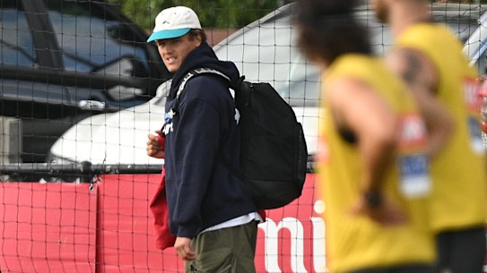 Jack Ginnivan of Collingwood (right) departs from a Magpies AFL training session at Olympic Park oval in Melbourne, Monday