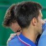 Juan Martin del Potro, of Argentina, cries while hugging Novak Djokovic, of Serbia, after defeating him in the first round of the   men's tennis at the 2016 Summer Olympics in Rio de Janeiro, Brazil,    
 - AP Photo/Vadim Ghirda)