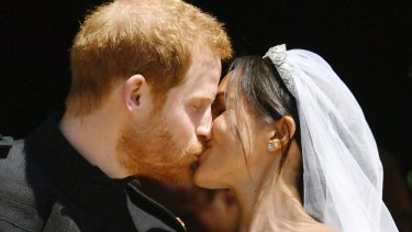Prince Harry and Meghan Markle kiss on the steps of St George's Chapel in Windsor Castle after their wedding in Windsor