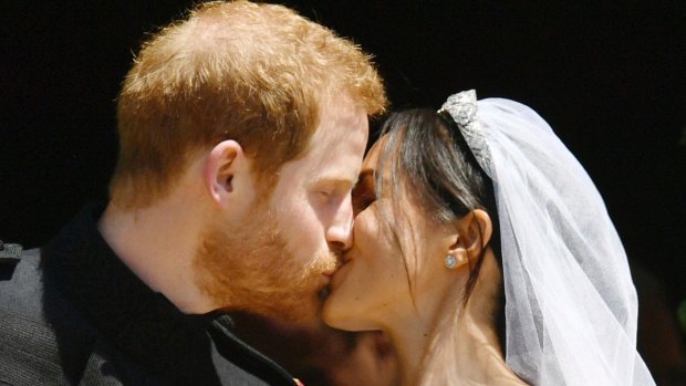 Prince Harry and Meghan Markle kiss on the steps of St George's Chapel in Windsor Castle after their wedding in Windsor