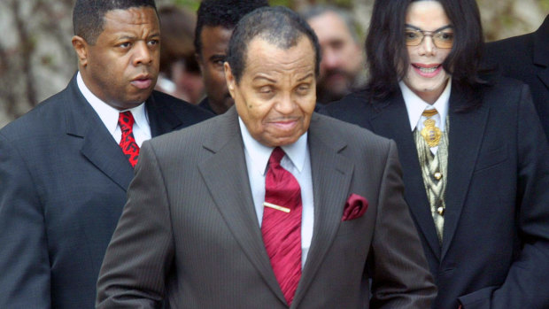 Joe Jackson (centre) with son Michael in March 23, 2005. The Jackson family patriarch died on Wednesday, aged 89.