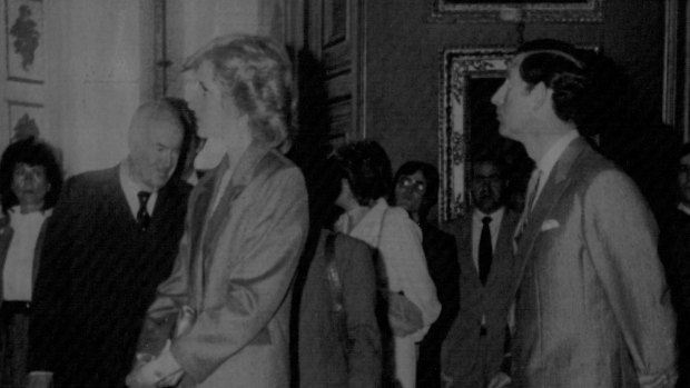 Sir Harold Acton with Princess Diana and Prince Charles as they admire art inside Pitti Palace in 1985. 