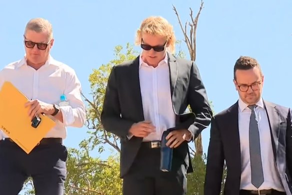 West Coast Eagles player Reuben Ginbey (centre) outside Joondalup Magistrates Court on Wednesday.