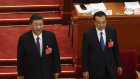 Chinese President Xi Jinping and Premier Li Keqiang, bottom right, arrive for the opening session of China's National People's Congress at the Great Hall of the People in Beijing. 
