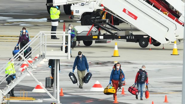 Passengers from the cruise ship, Greg Mortimer, arrive at Melbourne Airport from Uruguay.