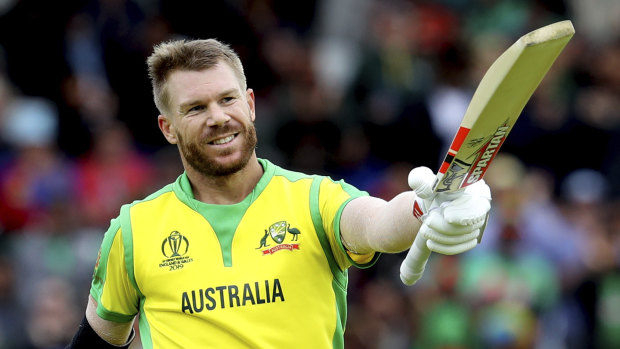 Tons of fun: David Warner celebrates a century against Bangladesh at the World Cup