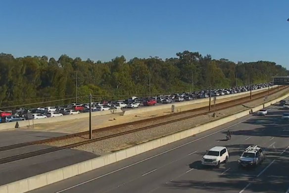 The Mitchell Freeway was backed up as emergency services attended the crash on Sunday morning. 