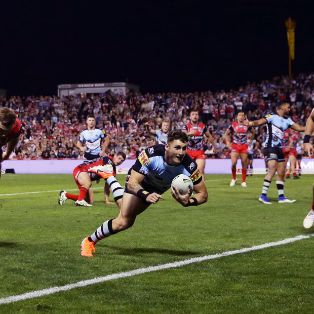 Bronson Xerri scores a try for the Sharks against the Dragons in 2019.