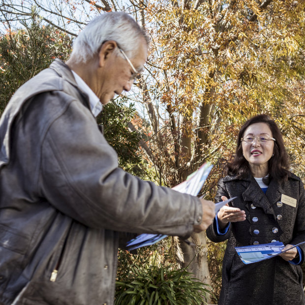 Gladys Liu greets a voter on election day in 2019, having worked polling stations assiduously for weeks.