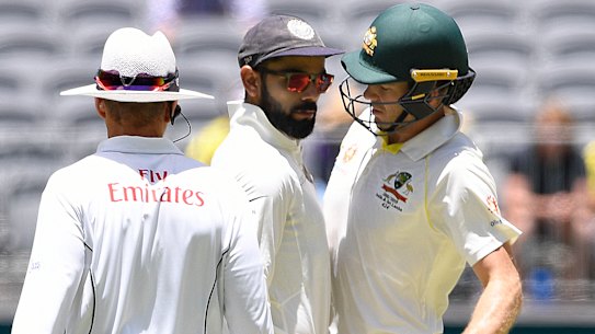 Clash: Virat Kohli and Tim Paine exchange words.