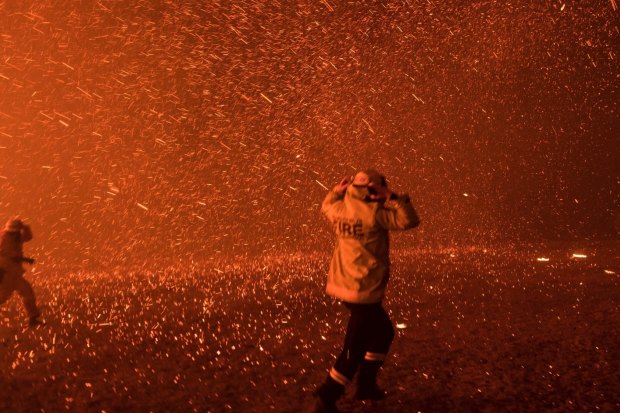 Firefighters run for safety as the Green Wattle Creek fire explodes into a sudden ember storm in Orangeville in December 2019, as captured in this award-winning photo by Nick Moir.