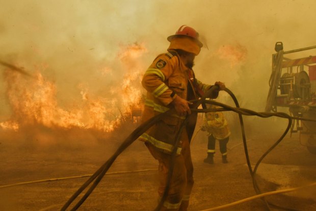 Spot fires threaten to overwhelm volunteer firefighters at the Hillville fire on NSW's Mid-North Coast in November 2019.