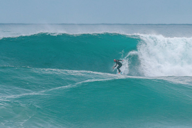 Formston heads down the front of a wave more than twice his size.