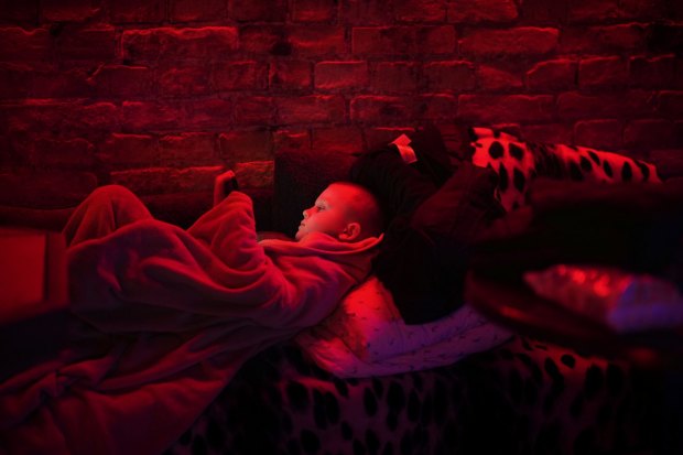 Svyatoslav, 6, plays with his tablet in a public basement used as a bomb shelter in Kyiv on February 24. 