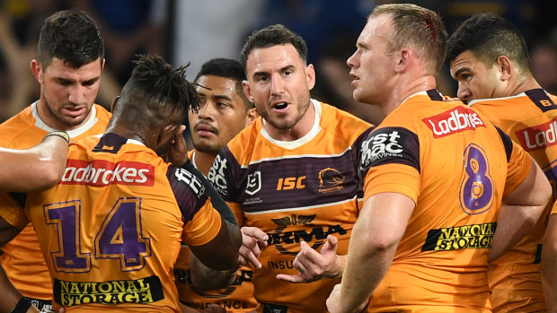 Skipper Darius Boyd speaks with teammates during the Broncos' horror loss to Parramatta on Sunday.