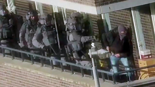 Armed police prepare for an operation in a residential area in Arnhem, Netherlands.