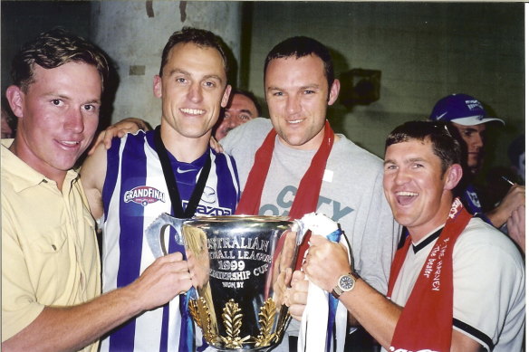 John Longmire with Corowa-Rutherglen mates after North Melbourne won the 1999 AFL premiership.