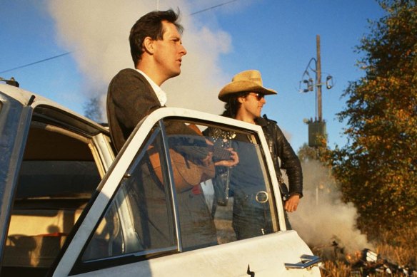 Bill Drummond, left, and Jimmy Cauty, with their car Ford Time Lord, in the documentary <i>Who Killed The KLF?</i>