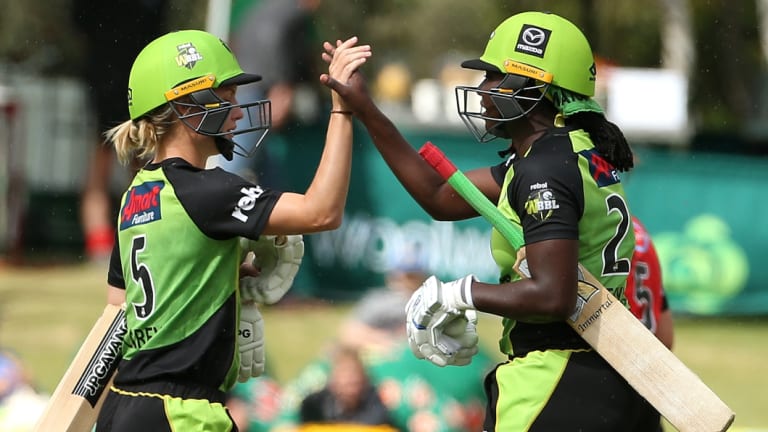 Thunder reigns: Nicola Carey (left) and Stafanie Taylor celebrate after scoring the winning runs against the Renegades.
