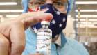 Prime Minister Scott Morrison with the AstraZeneca vaccine at CSL laboratories last week.