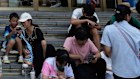 People scroll through their phones in Beijing. New digital ID laws mean Chinese authorities will be able to see the real identity behind online accounts across a range of sites.