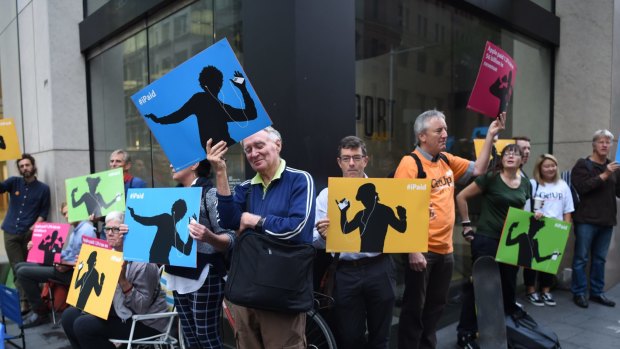 GetUp activists protest outside Apple regarding the multinational's tax avoidance.