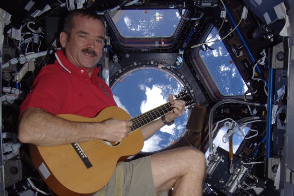 Astronaut Chris Hadfield has talked about his improved understanding of threats facing the planet since seeing Earth from space.