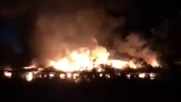 The abandoned retirement village goes up in flames in Carina Heights on Saturday night.