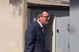 Daniel Andrews walking to a press conference yesterday. 