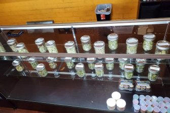 A display with jars of marijuana at Save Greens Cannabis dispensary in Los Angeles. Regulators do from time to time crackdown on the illicit pot market.