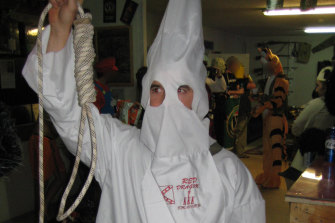 A special forces soldier dressed in a Ku Klux Klan outfit at a party at soldiers’ bar the Fat Ladies Arms in Afghanistan.
