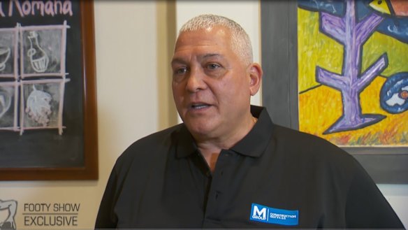 Mick Gatto wearing a shirt with an M Group logo in 2017.