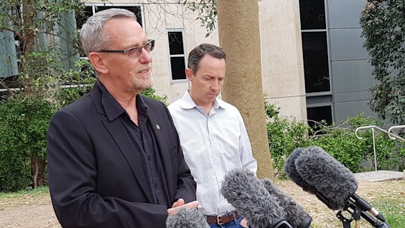 UQ scientists Professor Paul Young and Professor Trent Munro explain to the media why their vaccine program is being halted.