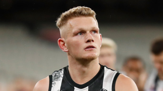 Adam Treloar's trade saga has ended with a move to the Bulldogs. 