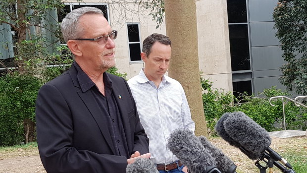 UQ scientists Professor Paul Young and Professor Trent Munro explain to the media why their vaccine program is being halted.