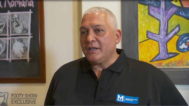 Mick Gatto wearing a shirt with an M Group logo in 2017.