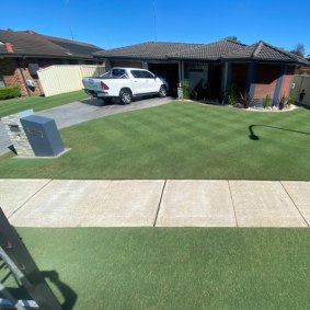 Glenn Russell’s diamond patterned lawn is so neat that most people think it is fake.