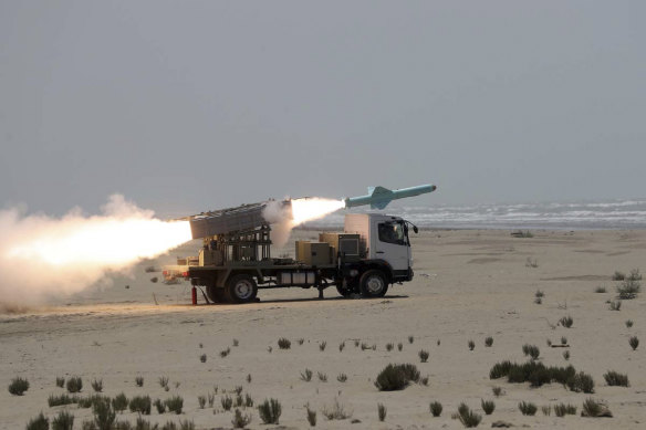 A missile is launched during a naval exercise in Iran.