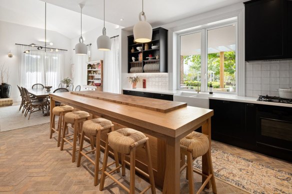 A custom Christian Cole island bench takes pride of place in the farmhouse kitchen.