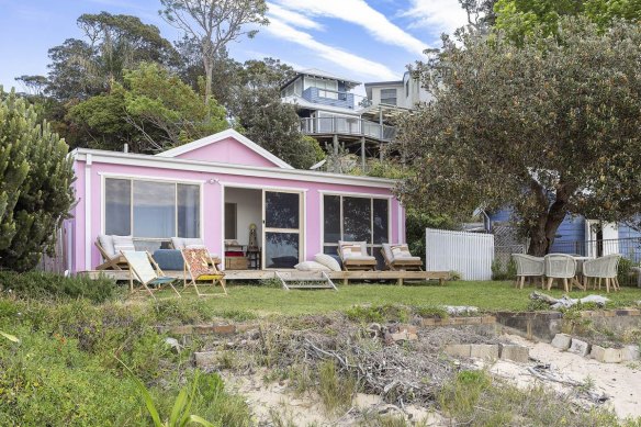 The landmark pink cottage was sold by stockbroker Tim Eustace and Salvatore Panui less than two years after they bought it.