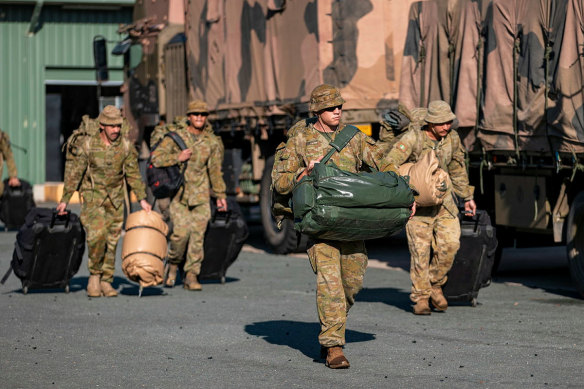 Soldiers load gear onto trucks at Gallipoli Barracks as part of Operation Flood Assist 2022.