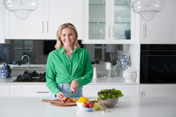 Ariarne Titmus relaxes in the kitchen. 