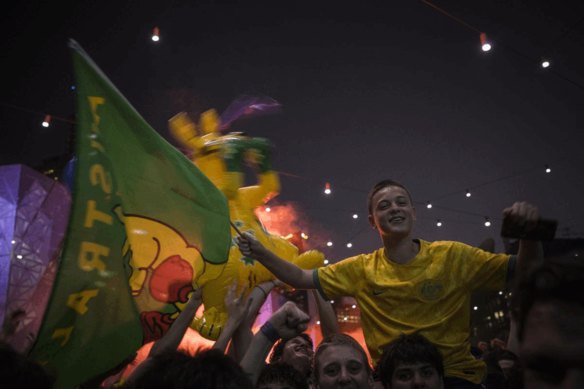 Socceroos fans celebrate at Federation Square.