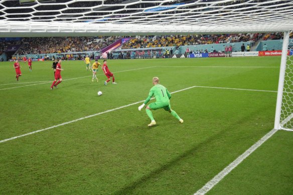 Mathew Leckie gets the better of Danish gloveman Kasper Schmeichel.