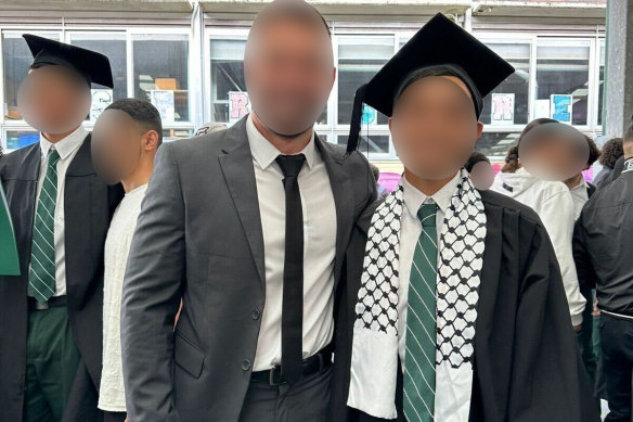 The 17-year-old wearing the scarf at his graduation ceremony in September.